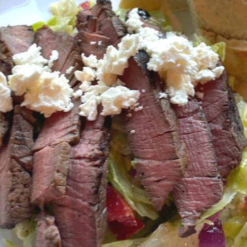 grilled steak salad plated